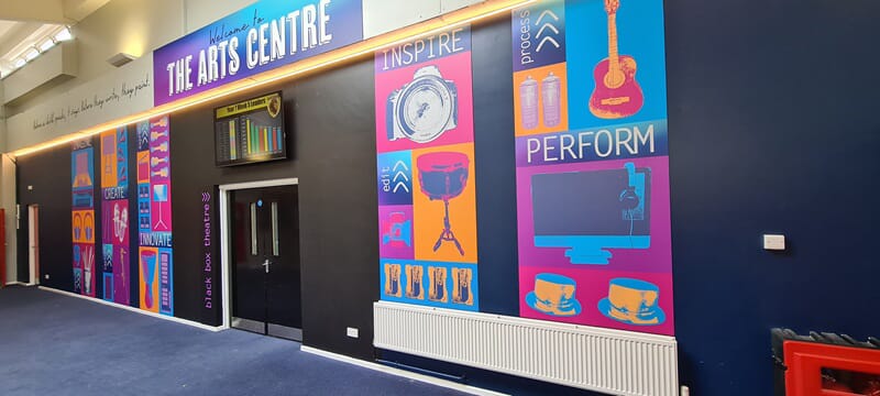 An image of the indoor signage and wall graphics for the arts centre.